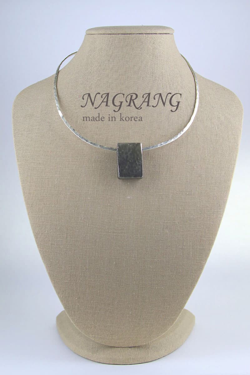 Square metal pendant with omega shape necklace